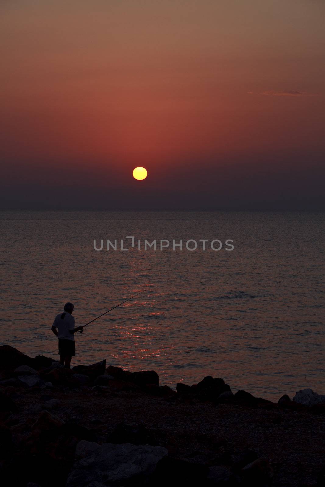 photo taken at the Greek sunset that show manner and type of feeding habits of the people
