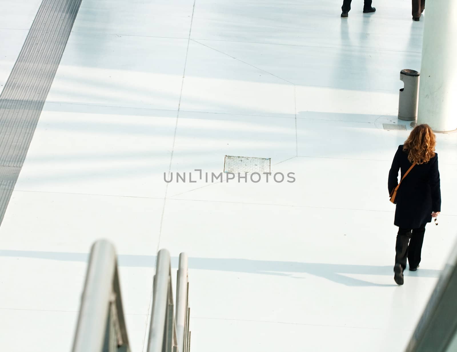 Woman walking after the escalator