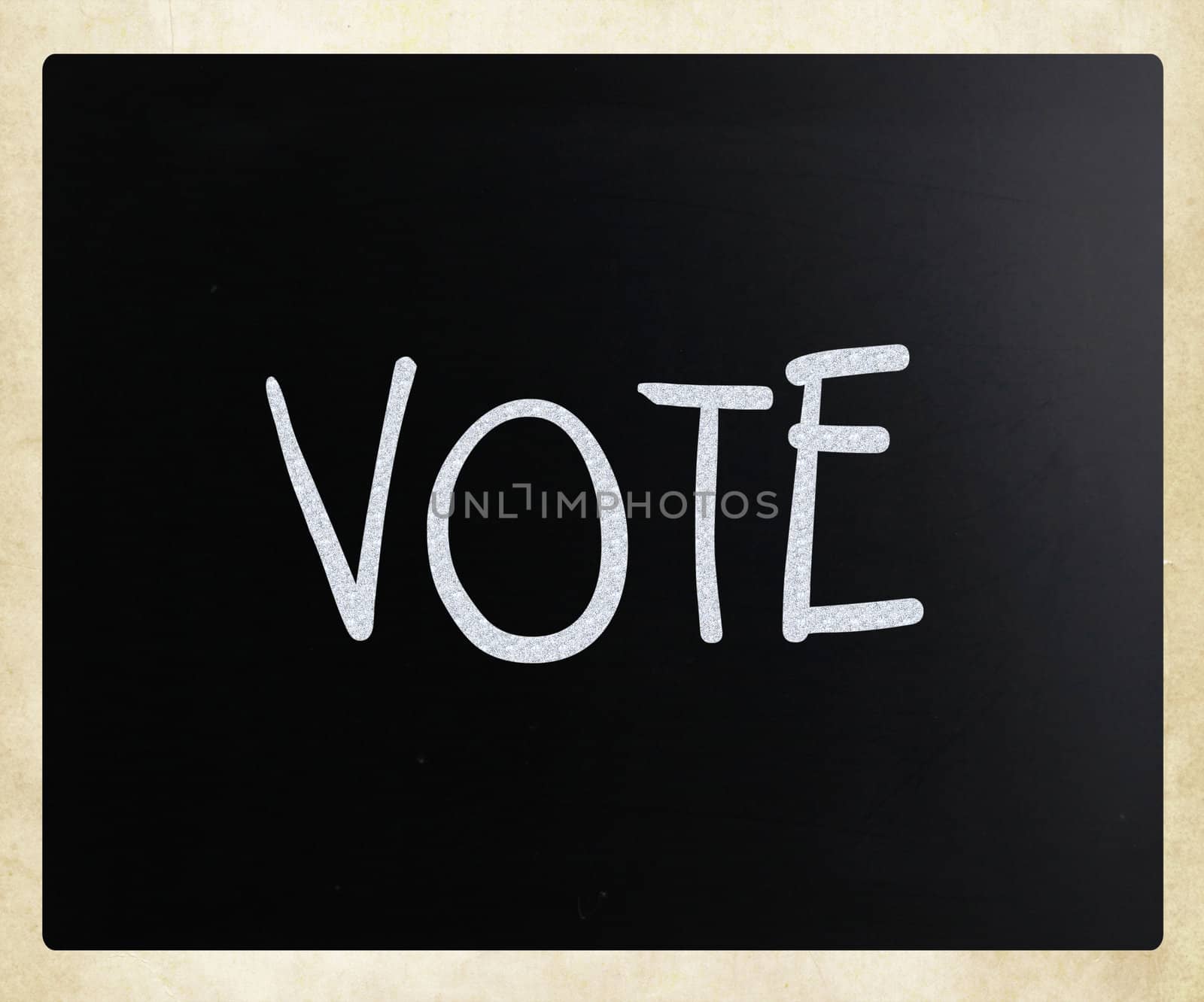 The word 'Vote' handwritten with white chalk on a blackboard