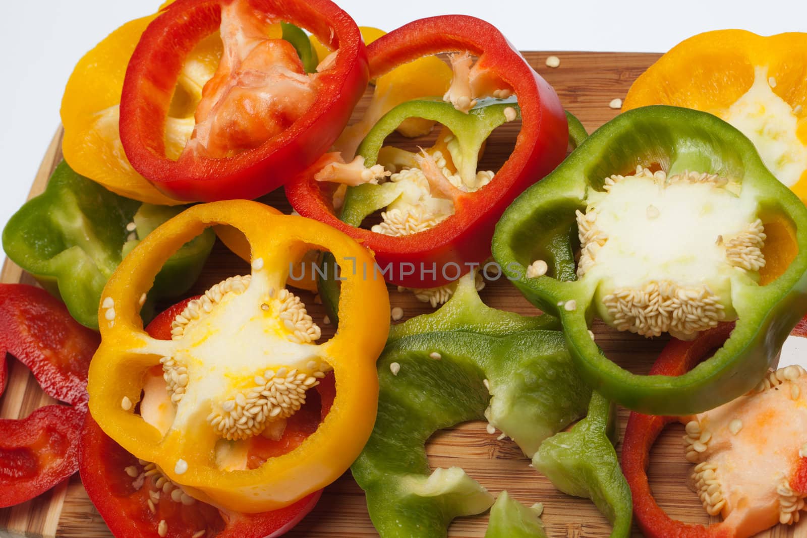 close up of red, yellow and green peppers
