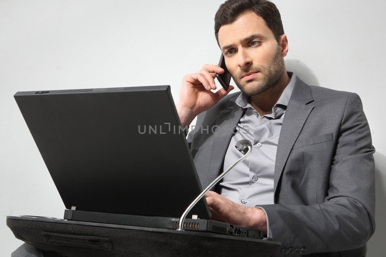 Young businessman working on is laptop