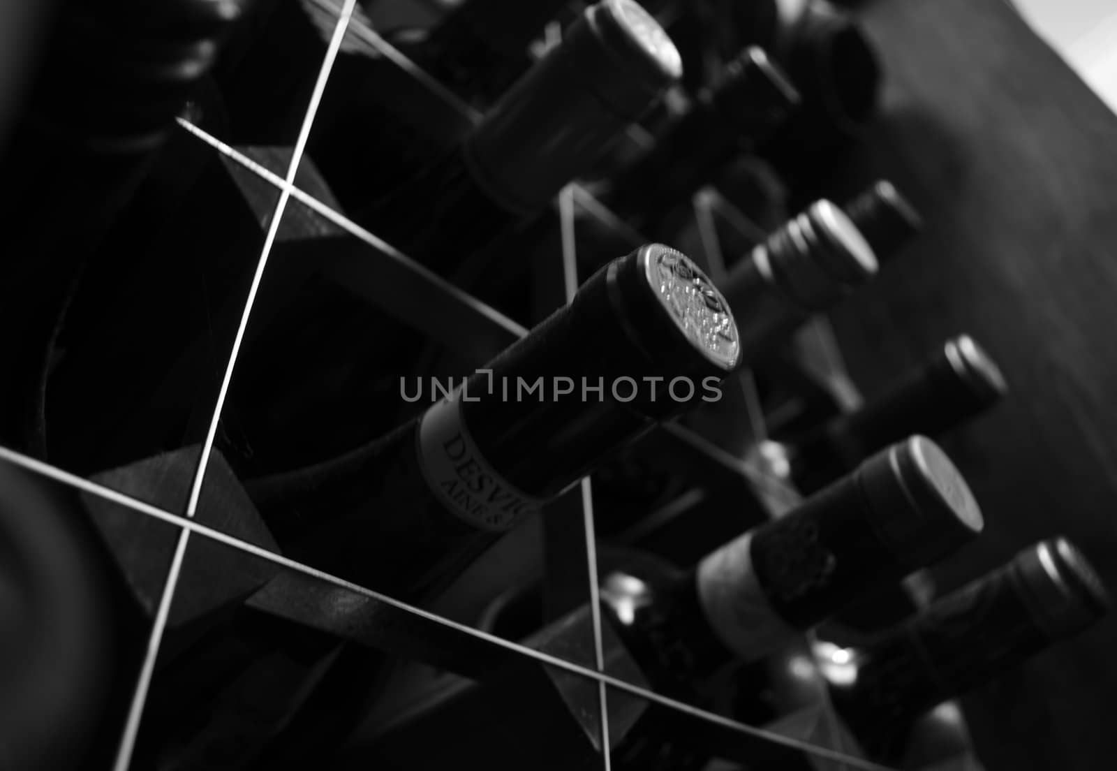 Monochrome, close upward angled view of wine rack