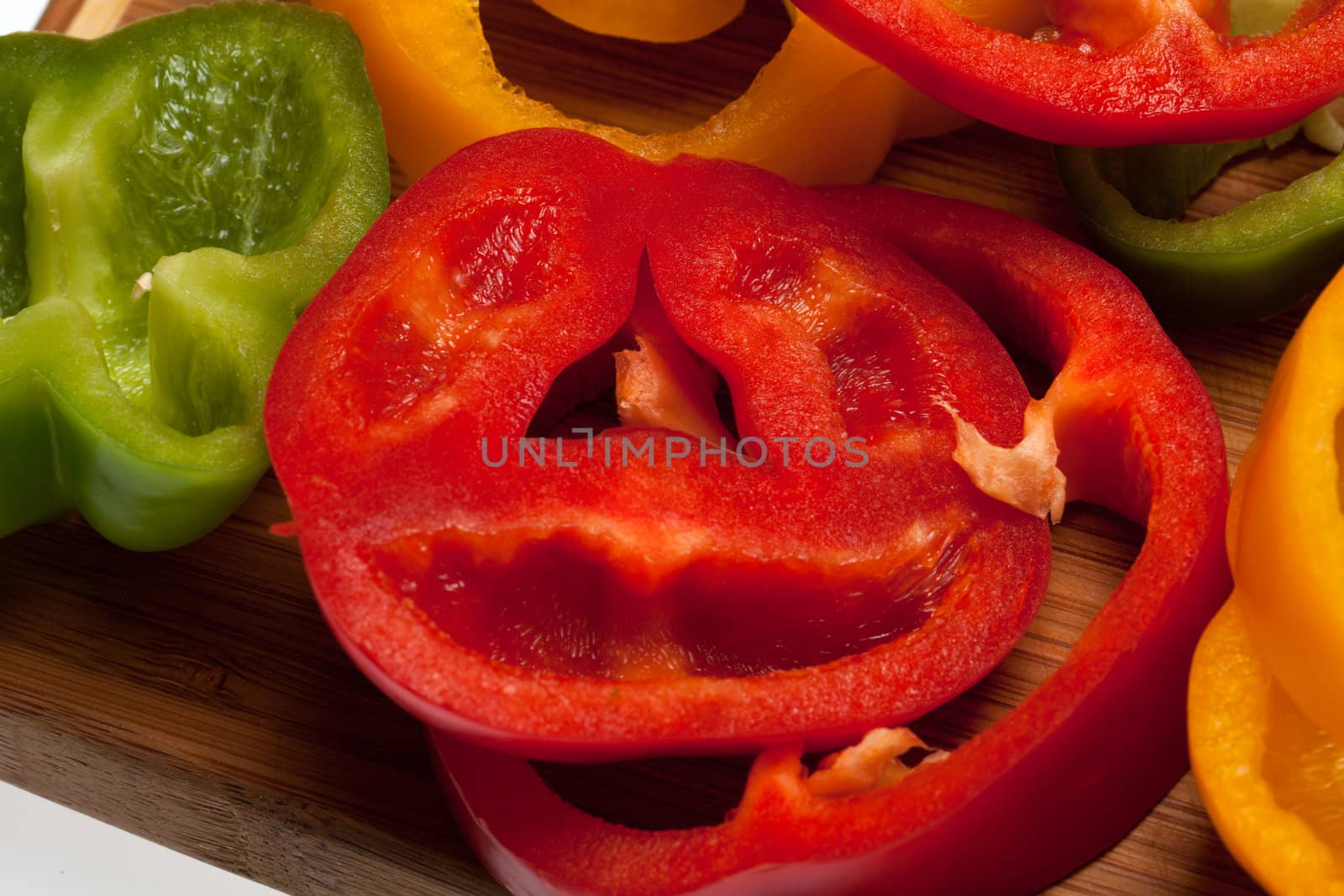 close up of red, yellow and green peppers