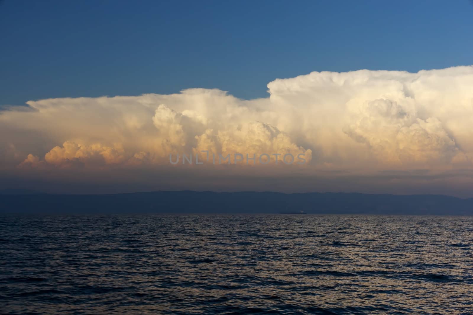 Cloudy sky on the sea at sunset