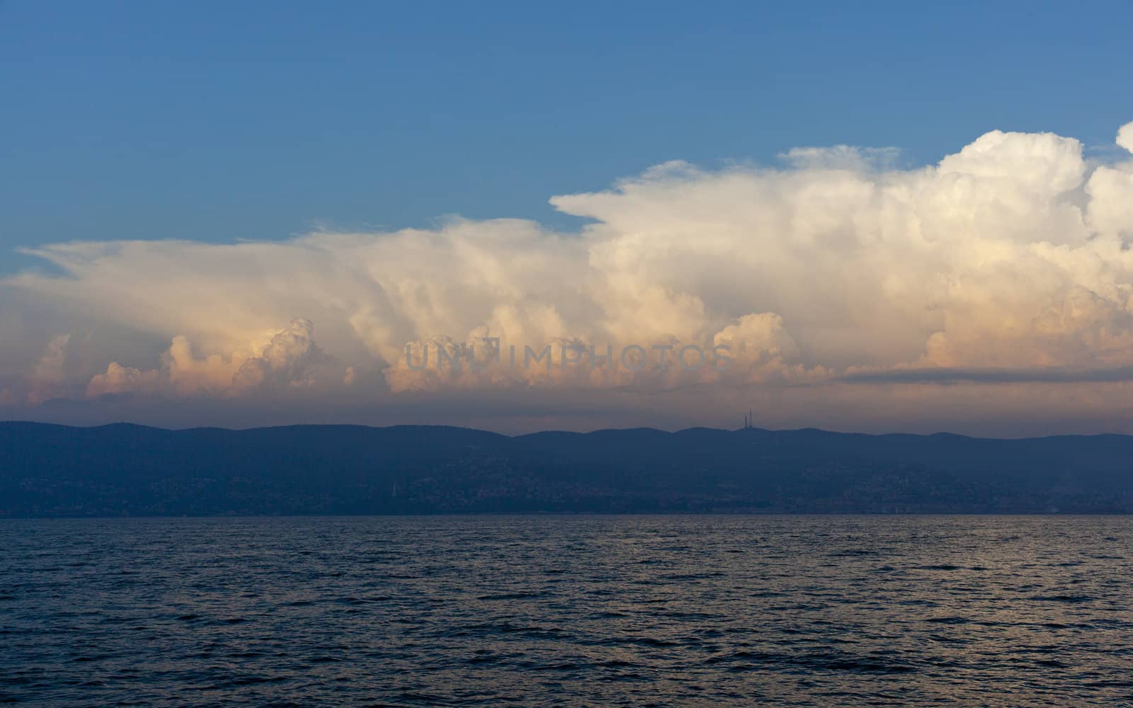 Cloudy sky on the sea at sunset