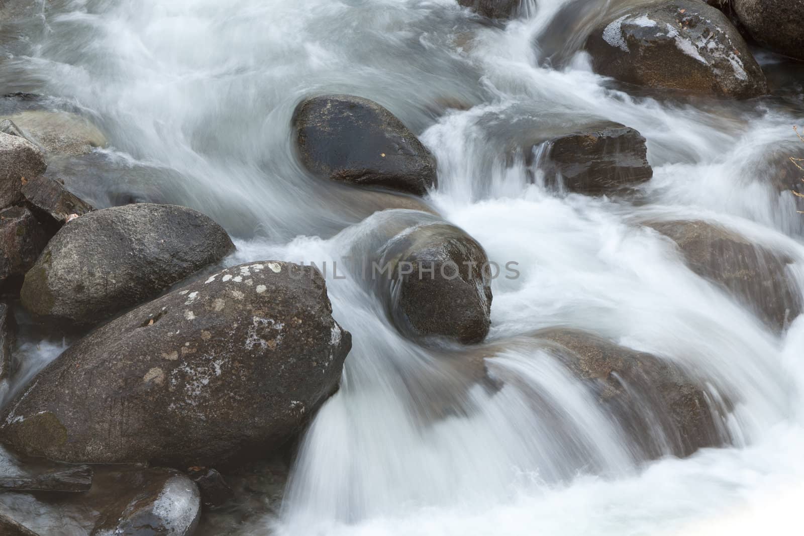 water flowing over rocks. by karelrod