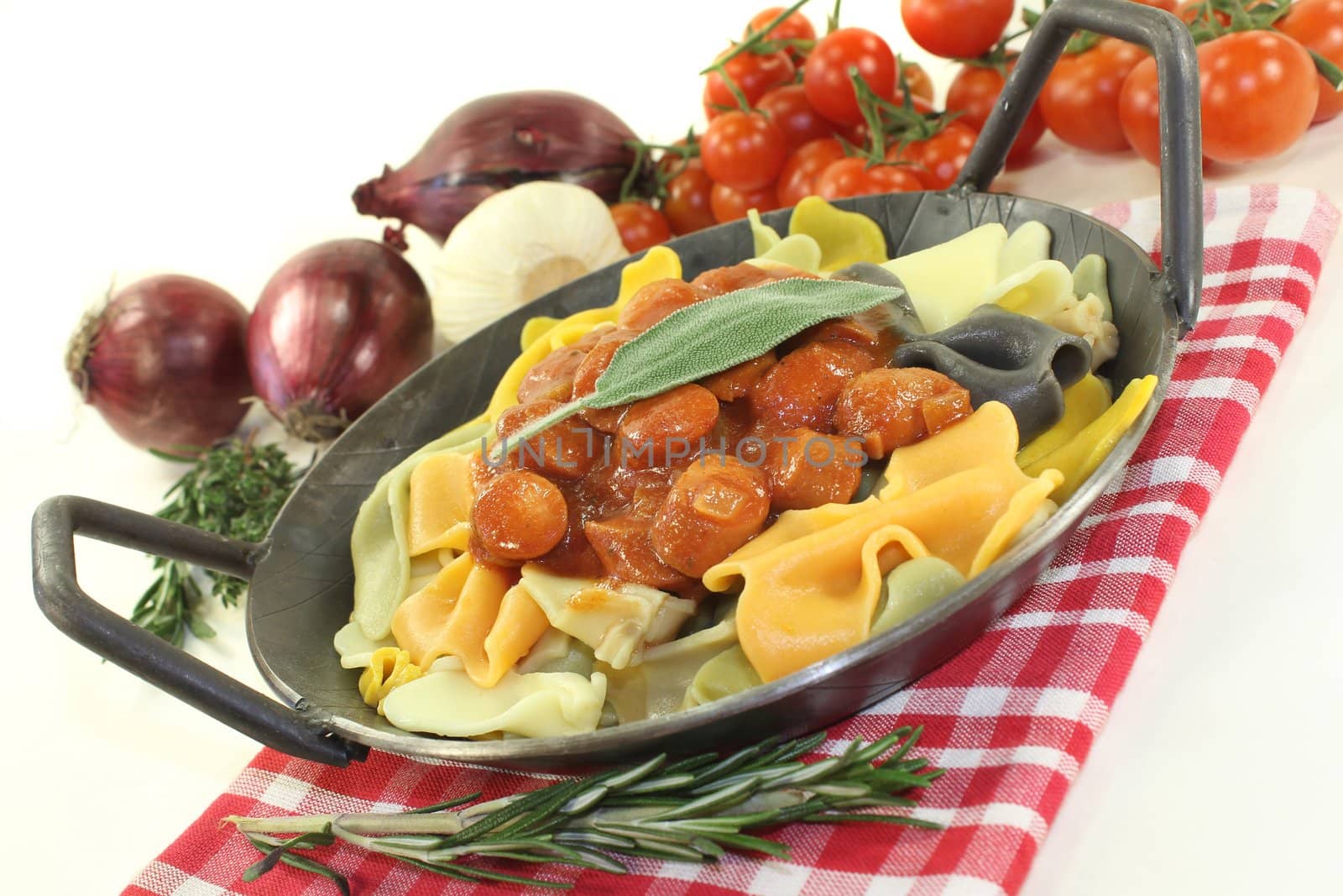 Pasta with tomato sauce and Mediterranean herbs