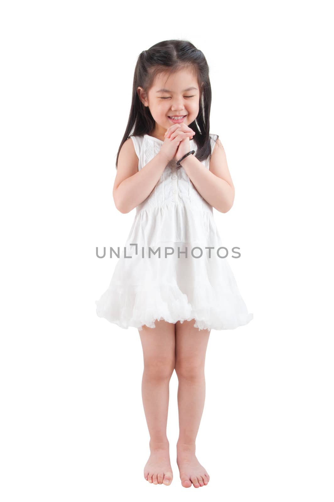 Full body East Asian girl making a wish with smiling, standing isolated on white background 