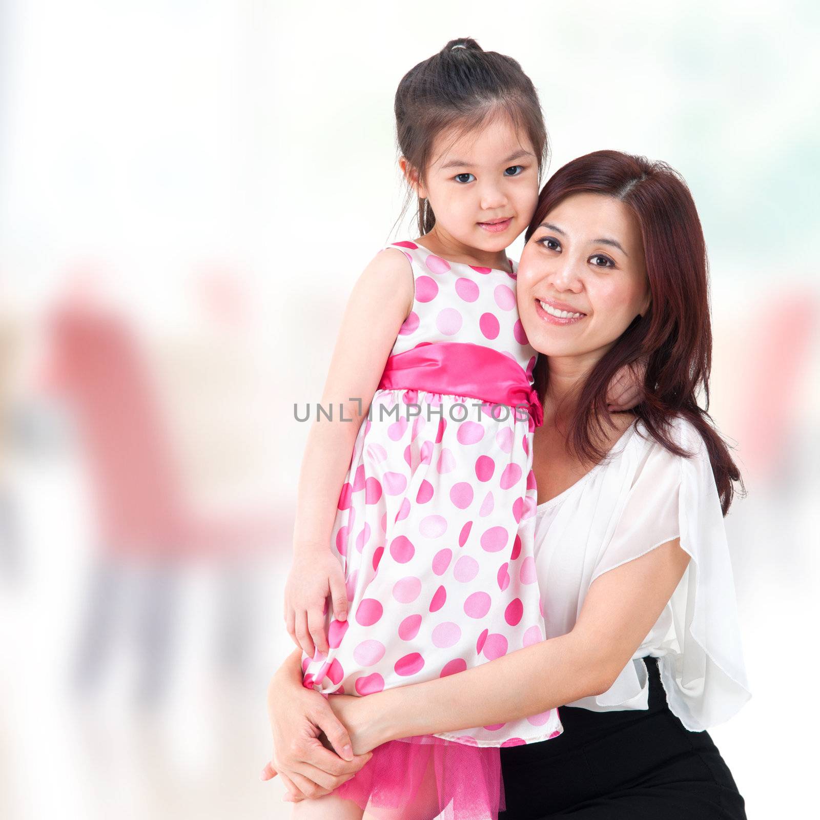 Asian family parent and child. Mother and daughter at home.