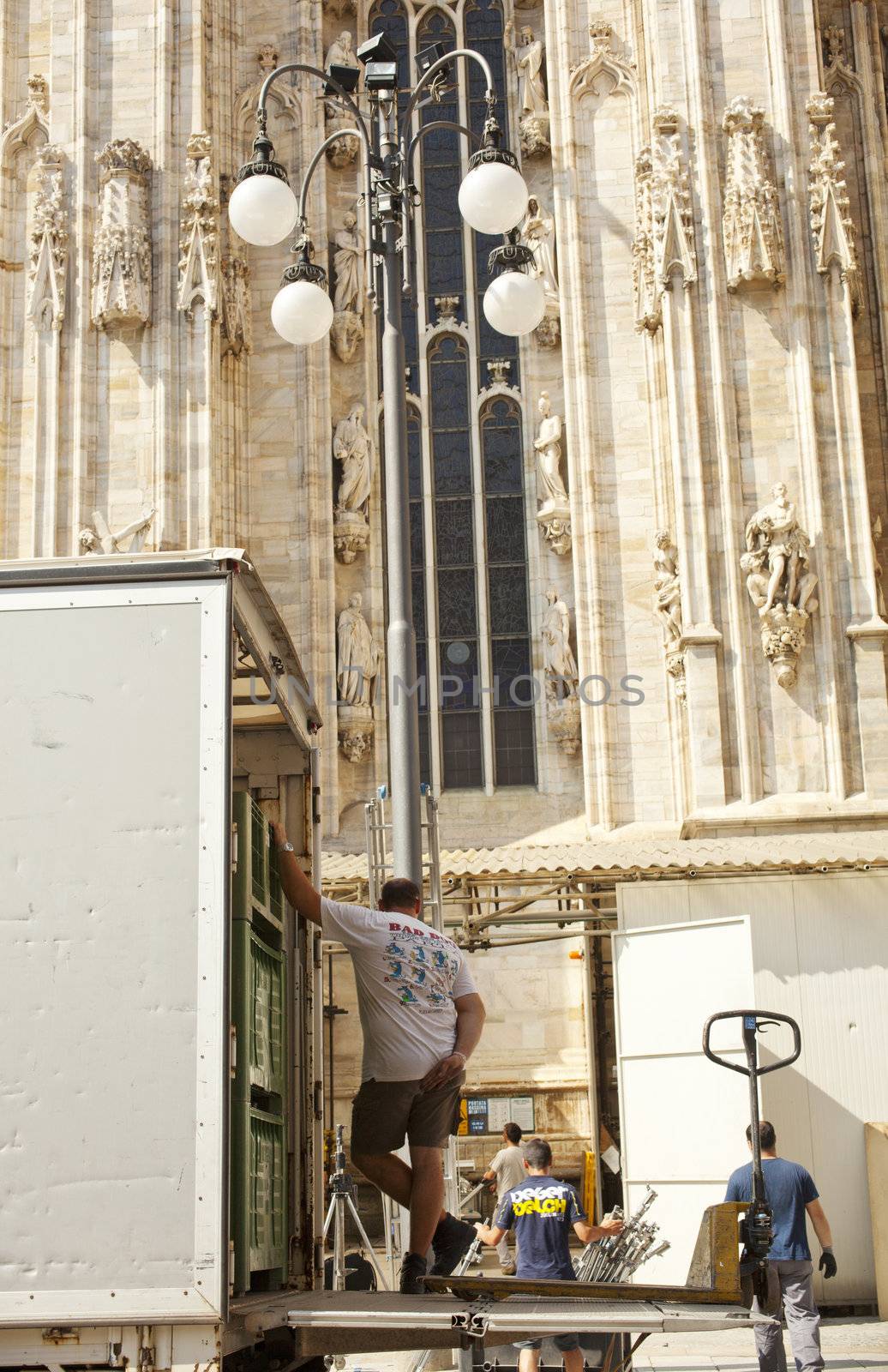 Worker next to the Milan catheedral, Italy