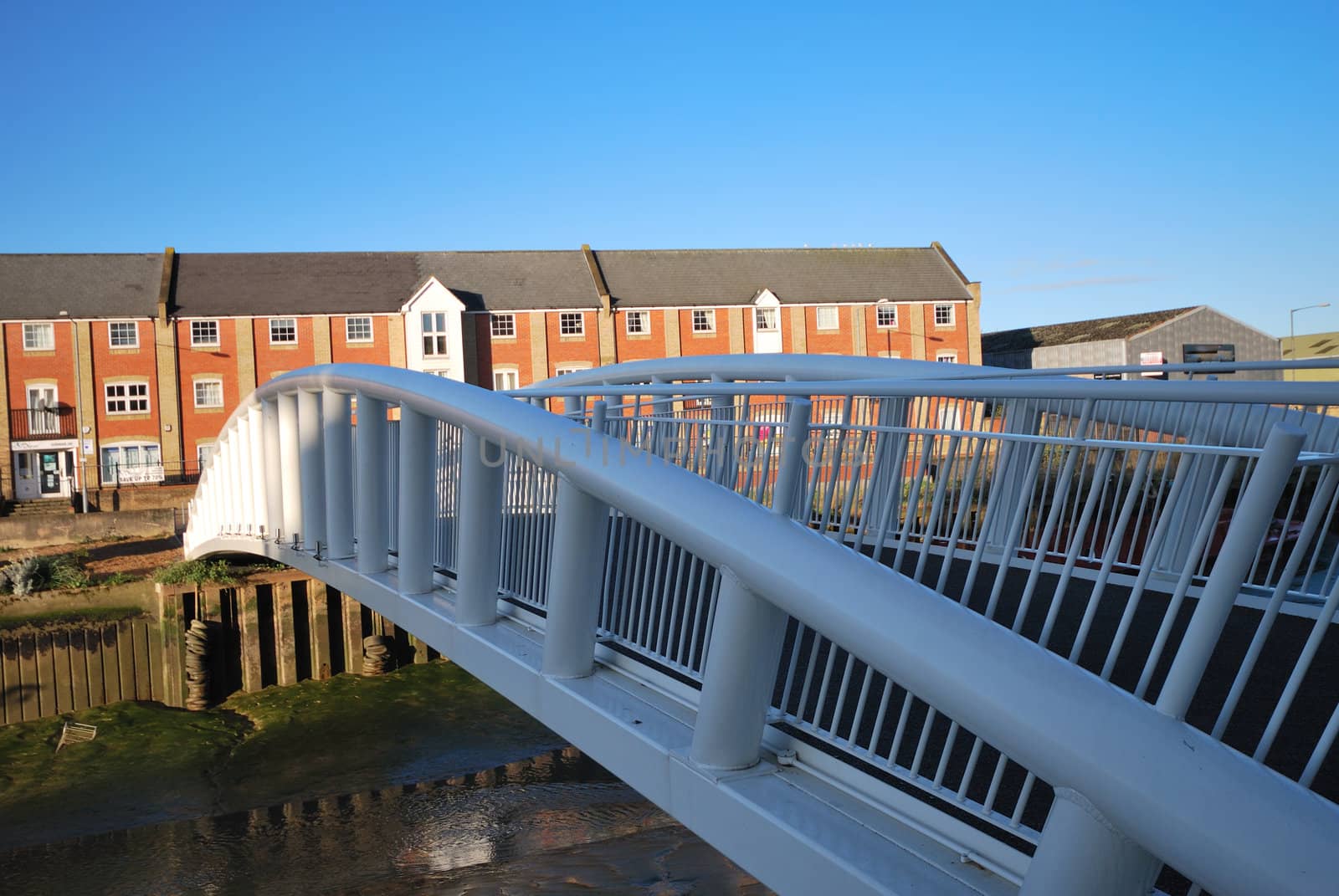 modern flats with bridge in foreground