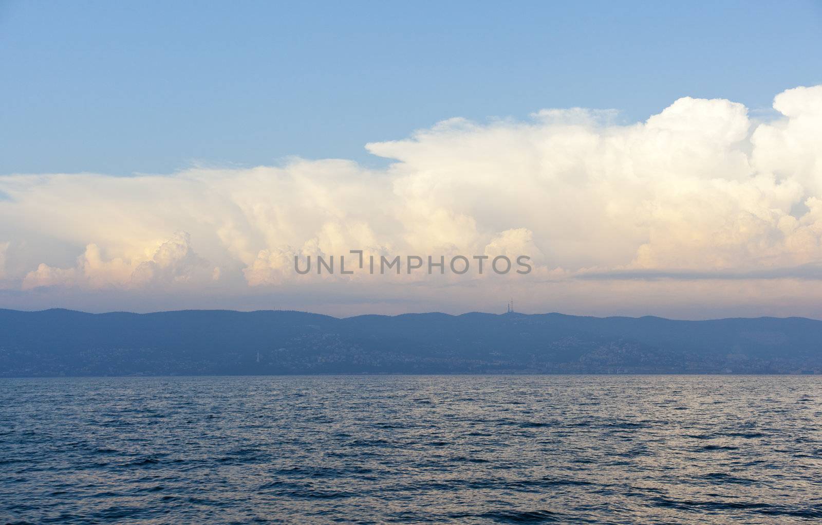 Cloudy sky on the sea at sunset