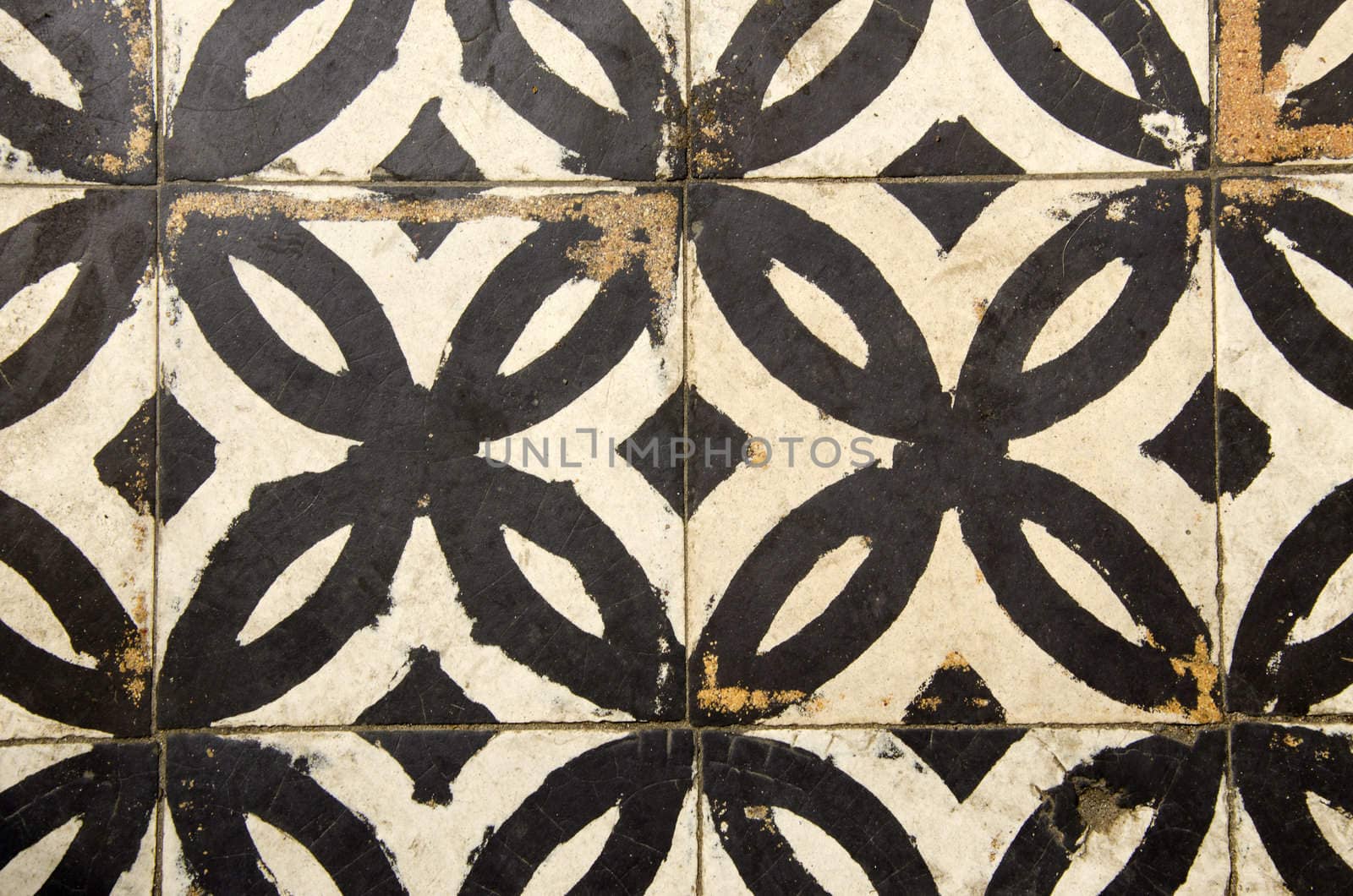 Antique floor tiles abraded backdrop in corridor. by sauletas