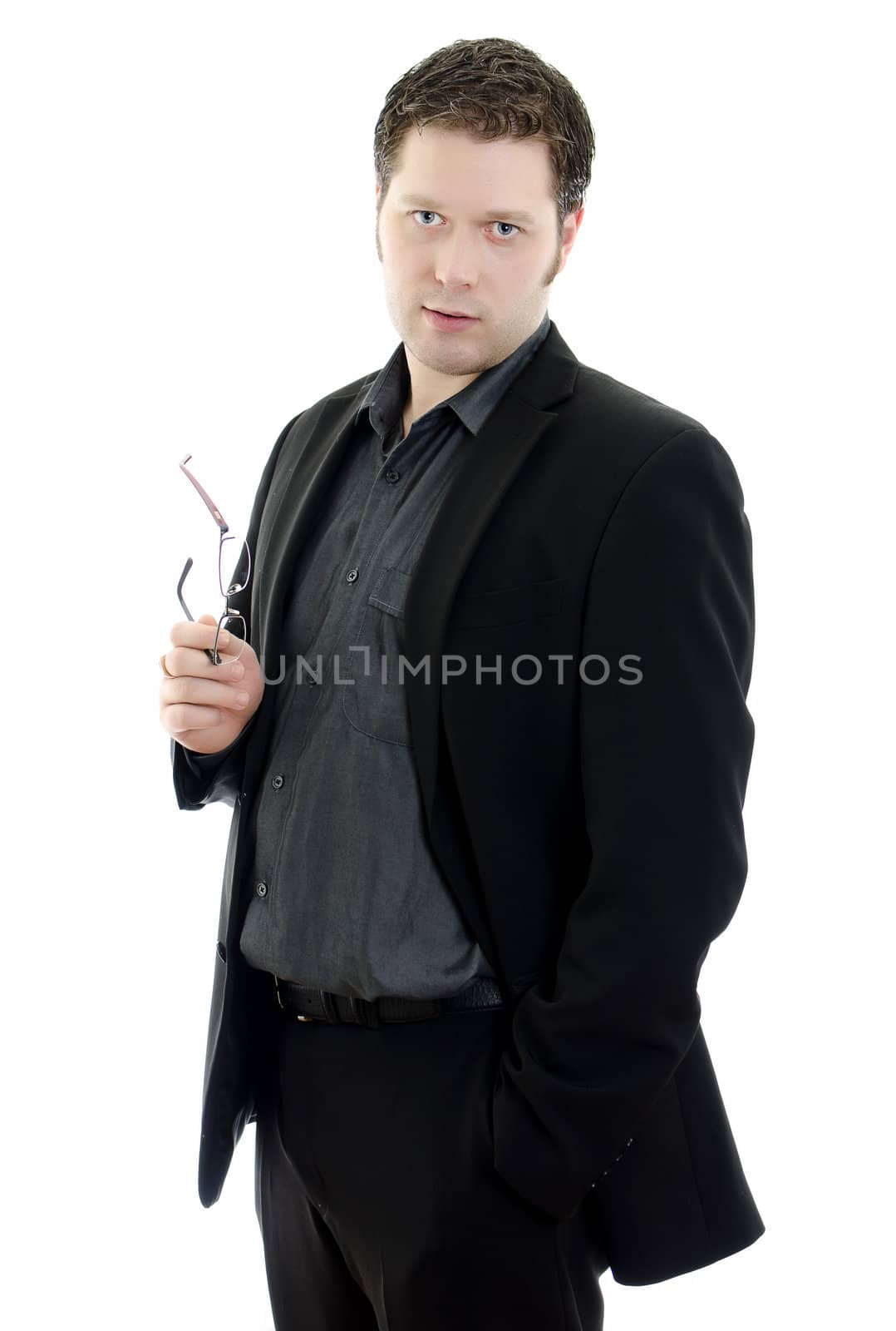 Portrait of a handsome young business man with glasses. Isolated on white background with copy space.