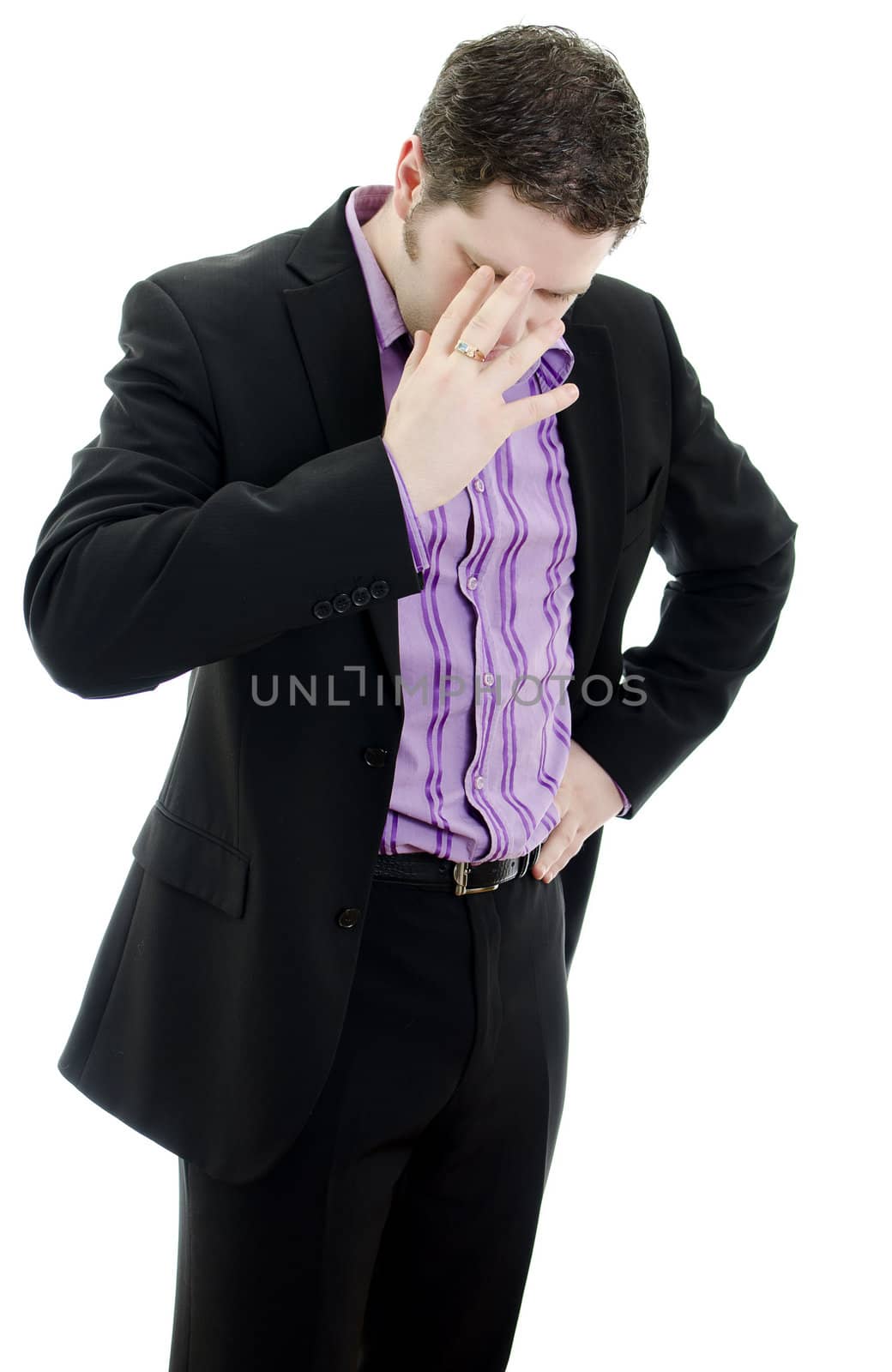 Portrait of a young business man looking depressed from work. Isolated over white background
