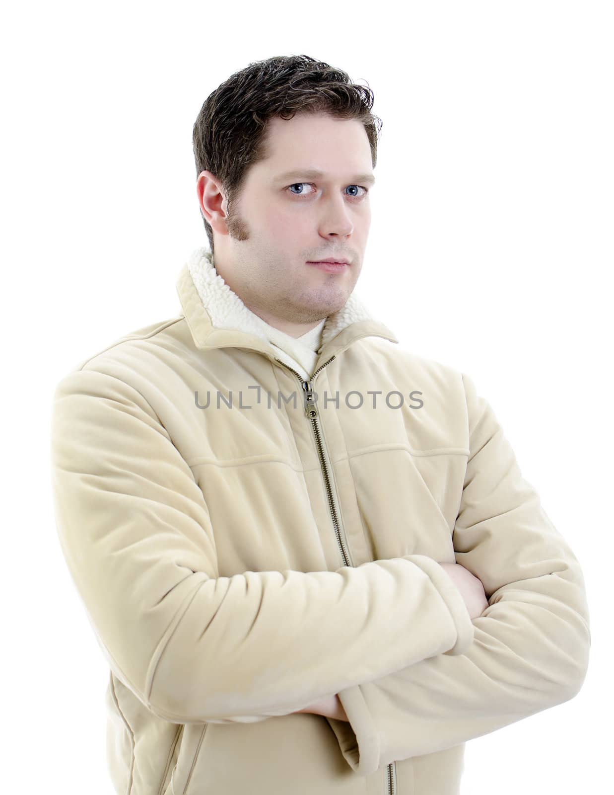 Portrait of a handsome young man in winter coat with arms crossed. Isolated on white background with copy space.