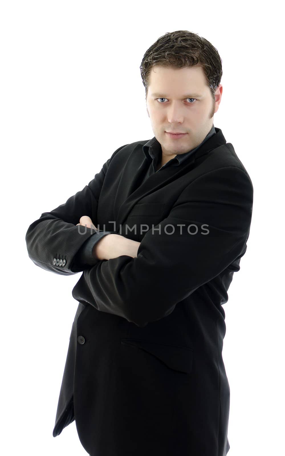 Portrait of a handsome young business man with arms crossed. Isolated on white background with copy space.