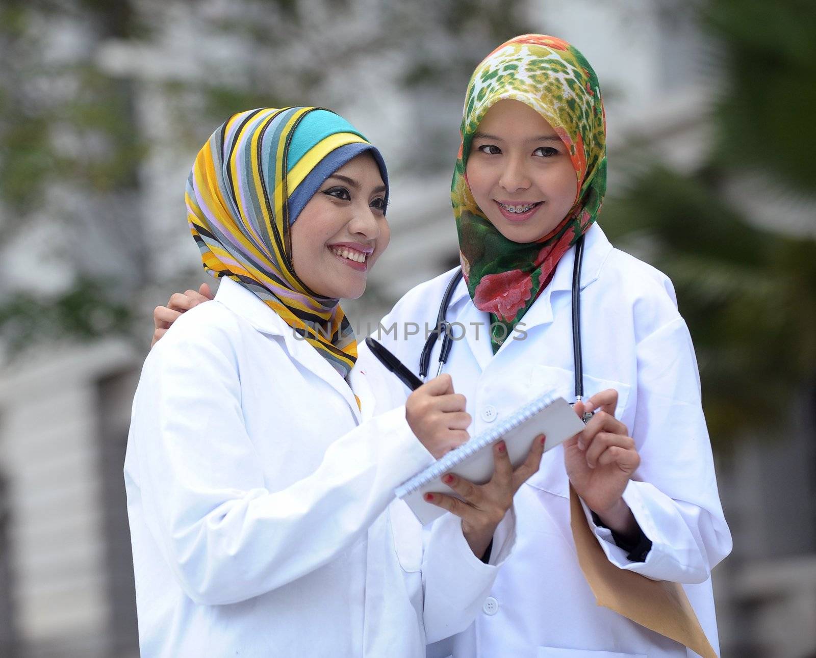 Two Women Doctor With Scarf, Outdoor by jaggat