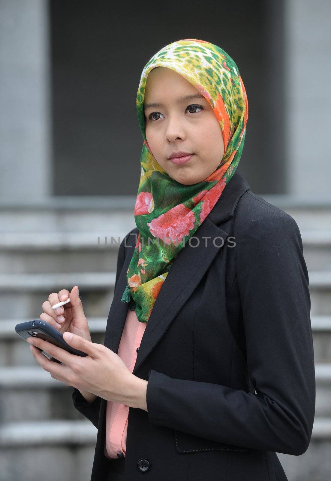 Scarf girl use smart phone by jaggat