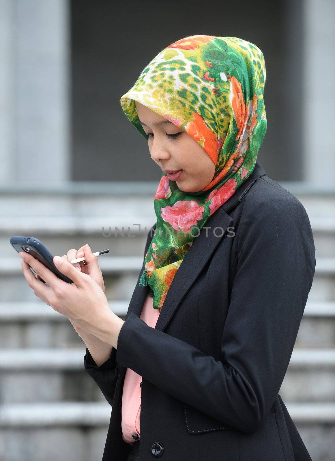 Scarf girl use smart phone by jaggat