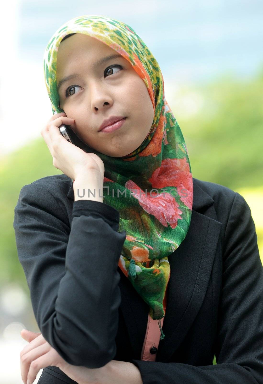 Scarf girl use smart phone by jaggat