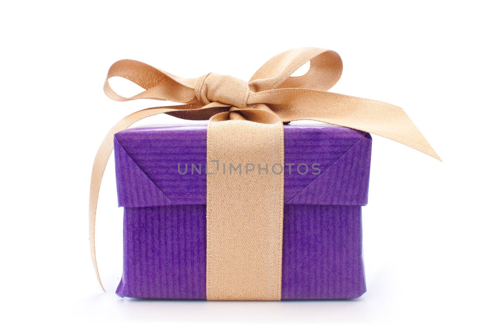 Purple gift box with a gold ribbon 