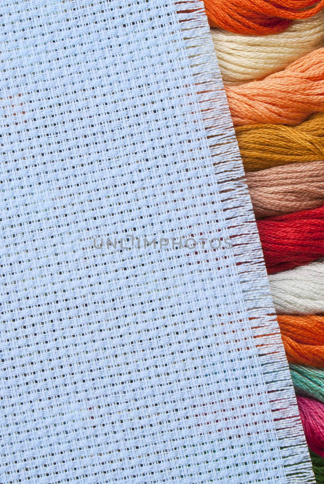 Needlework, materials and accessories for embroidery a cross