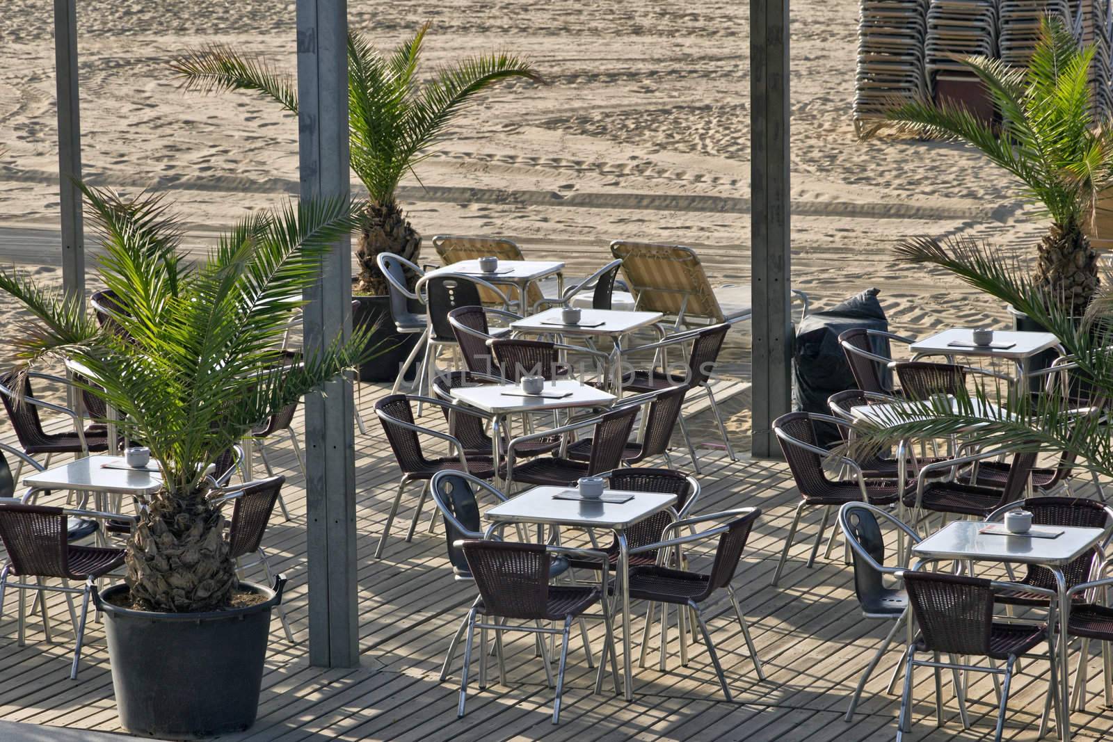 Cafe on the morning beach, Barcelona, Catalonia.