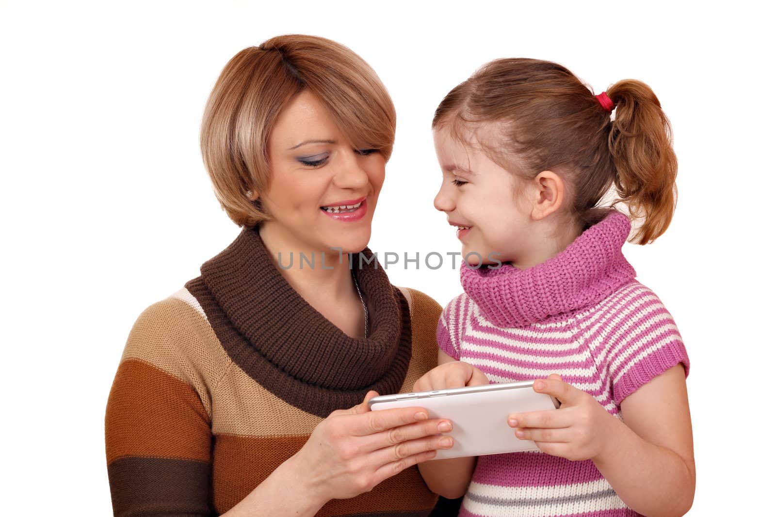 happy mother and daughter play with tablet pc on white by goce