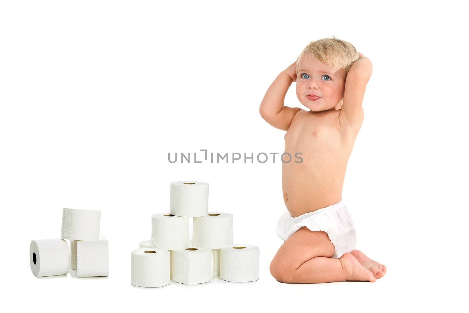 Blue eyed baby girl with hands on head with a bunch of toilet rolls. Isolated on white background.