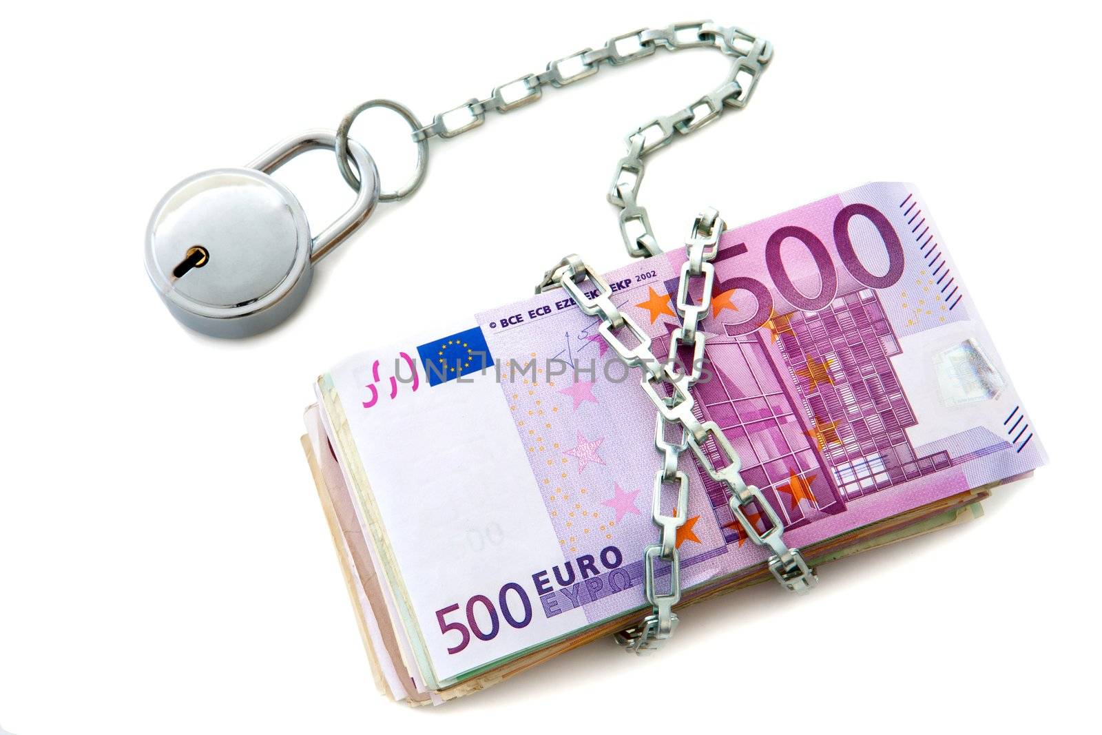 Pile of euro bank notes chained up with padlock. Isolated on white