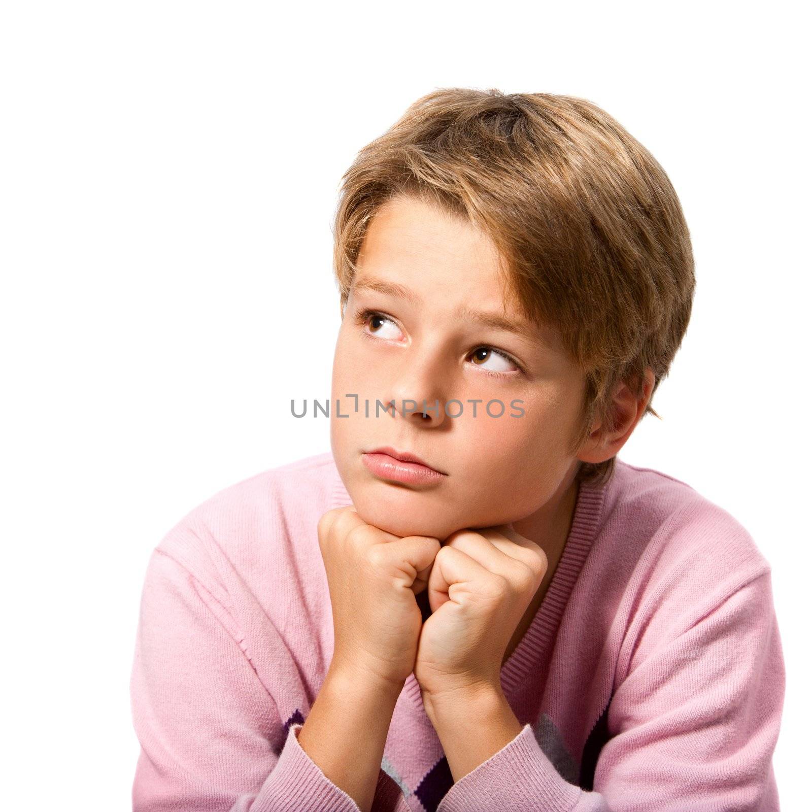 Portrait of handsome teen boy resting with face on hands with wondering expression. Isolated on white background