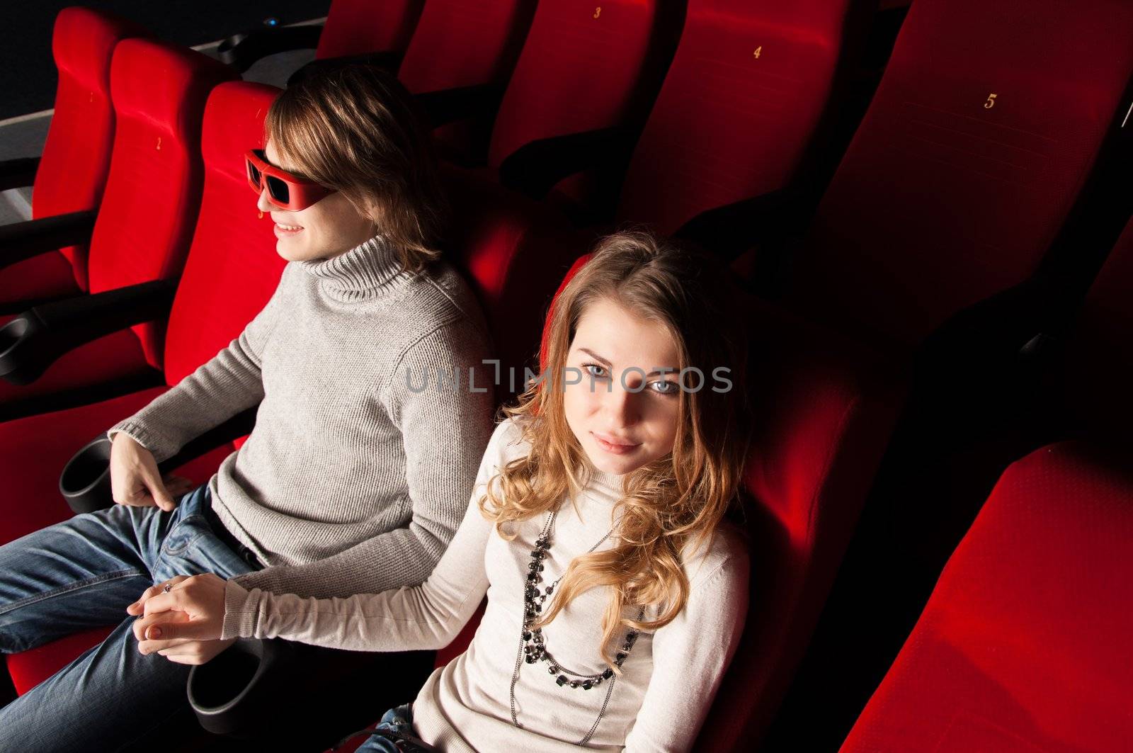 young couple in the cinema to enjoy the movie