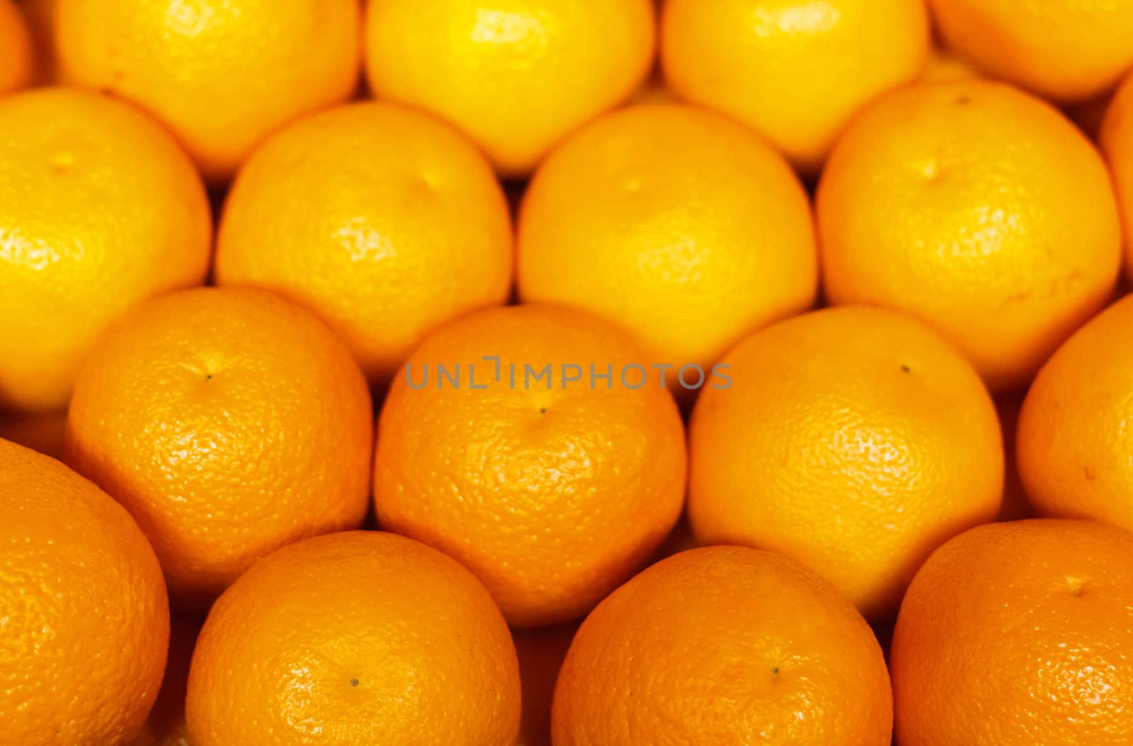 Pile of bright ripe oranges at the farmers market