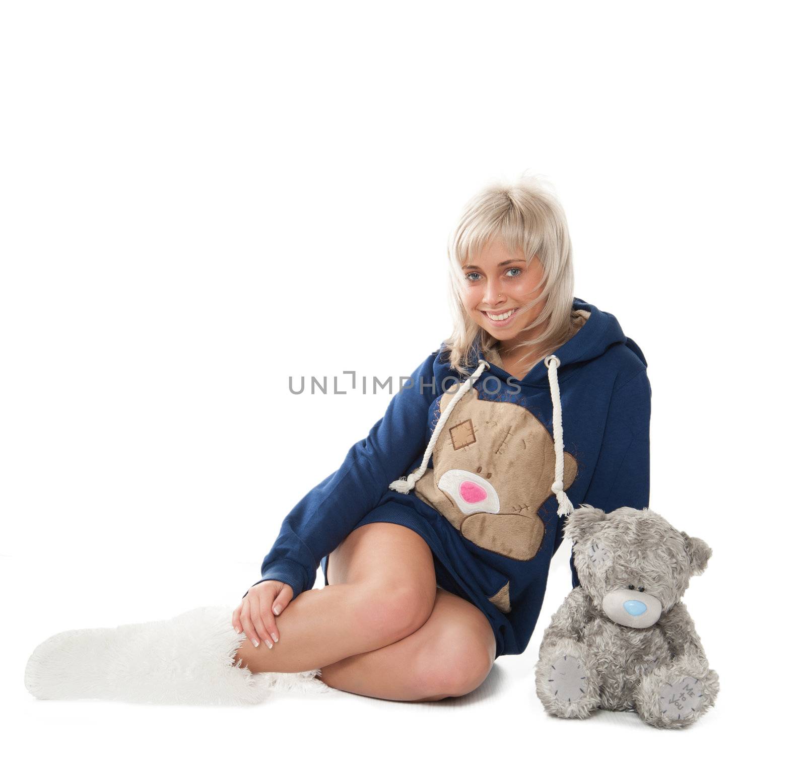 beautiful girl sitting on the floor with a bear