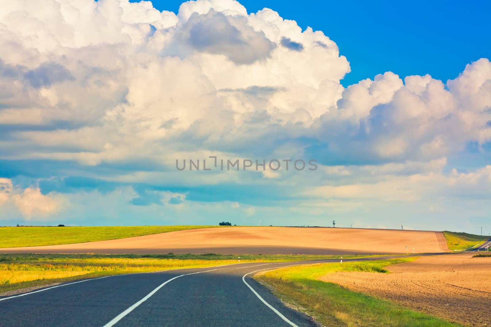 Empty curved road, blue sky by ryhor