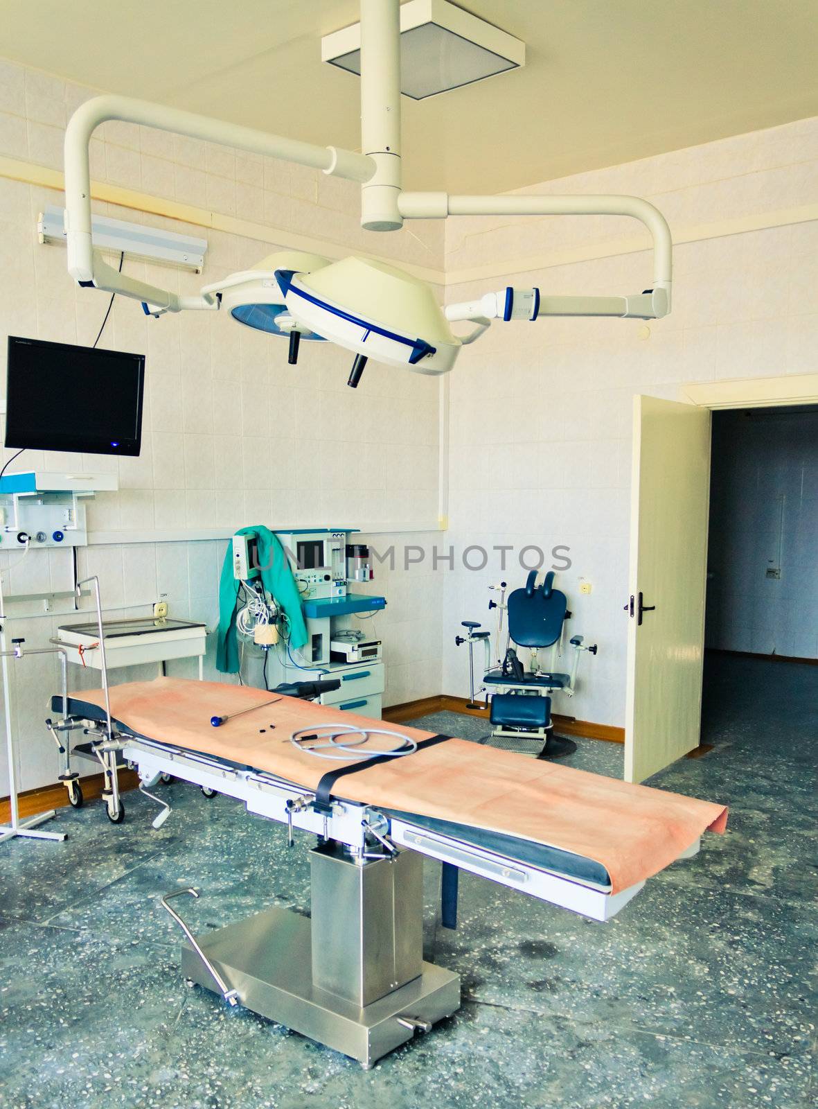 Equipment for the operating room. Special lamps, monitor and desk. Vertical format.