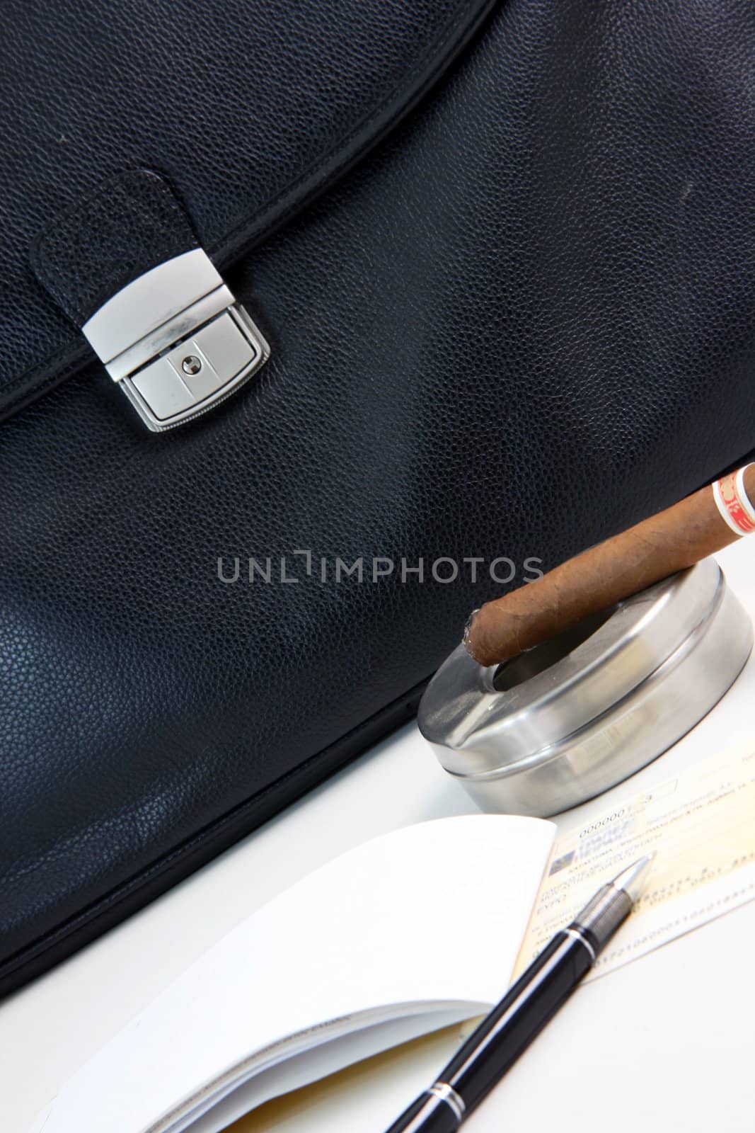 financial deal check writing cigar with black leather briefcase background praspective business concepts