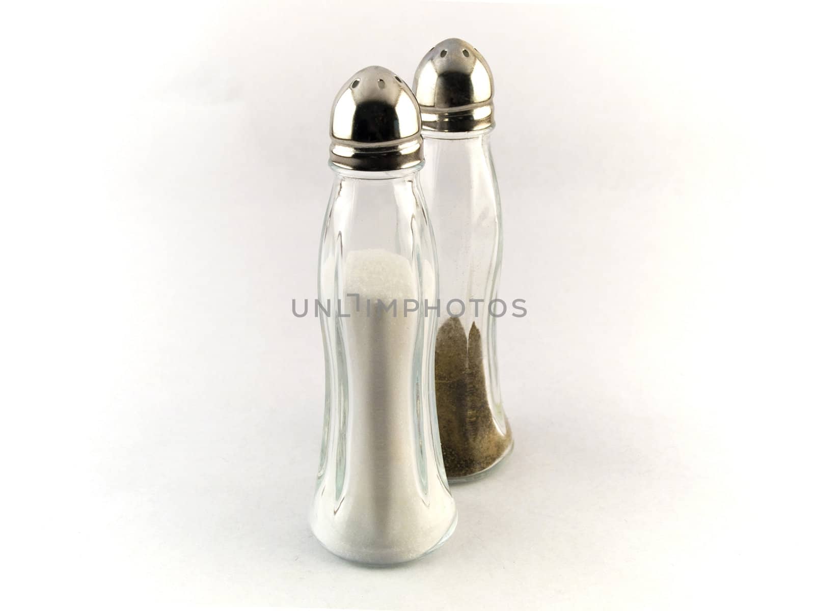 Salt and Pepper Pots on White Background by bobbigmac