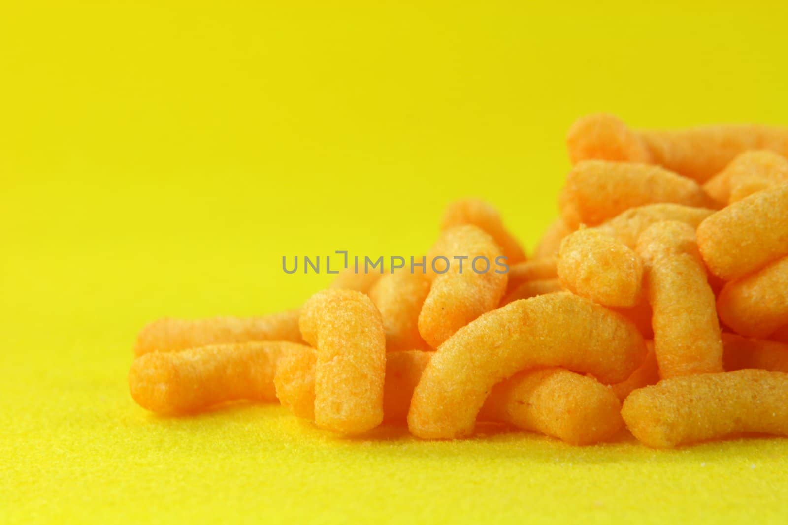potato snacks with yellow background food concepts