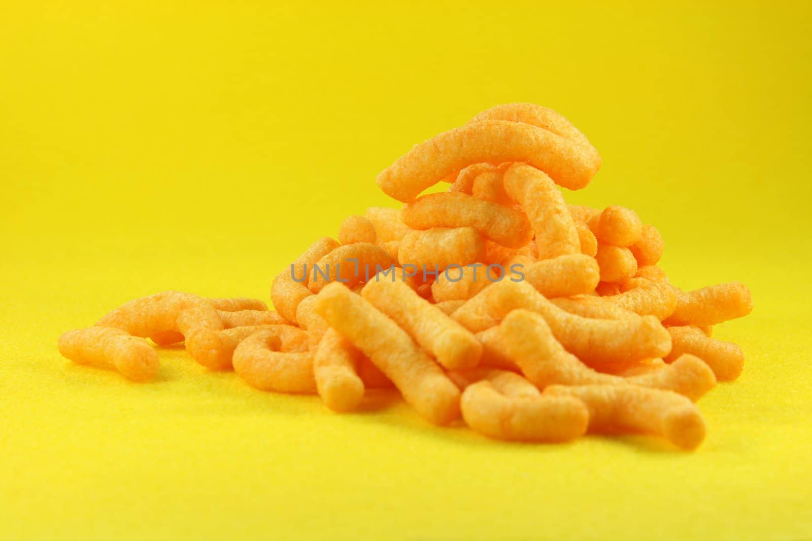 potato snacks with yellow background food concepts