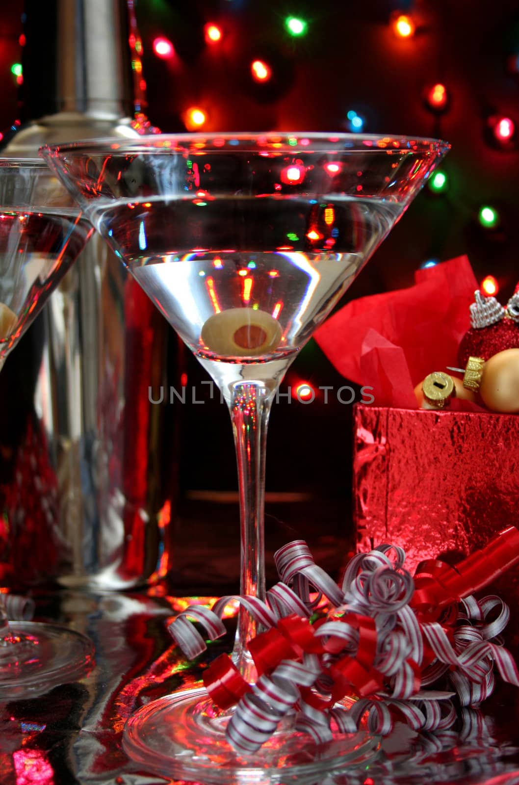 Martini with an olive in a low light image. Perfect for Christmas or New Years ad.