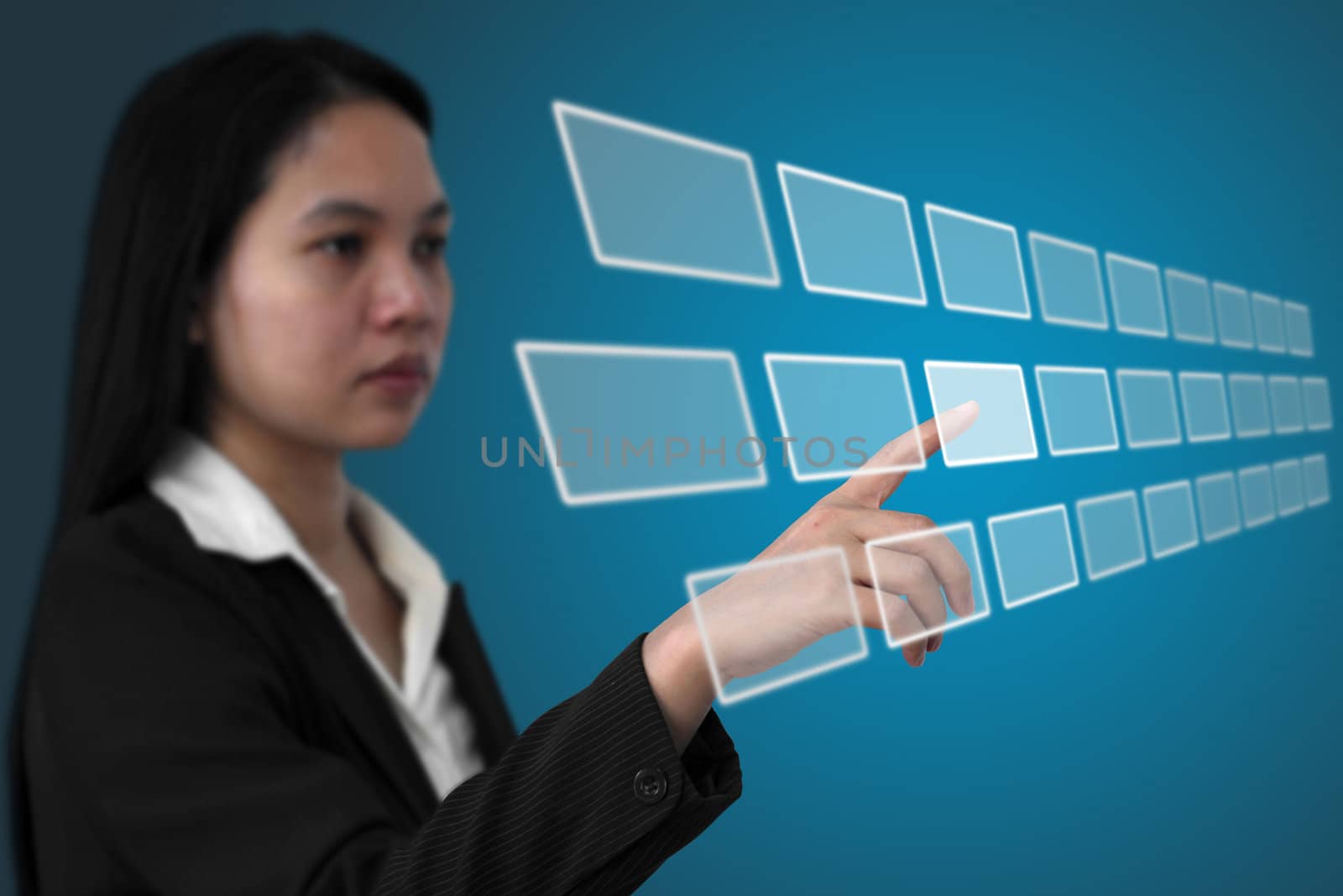 asian business woman touch on touchscreen interface (Selective focus on finger)
