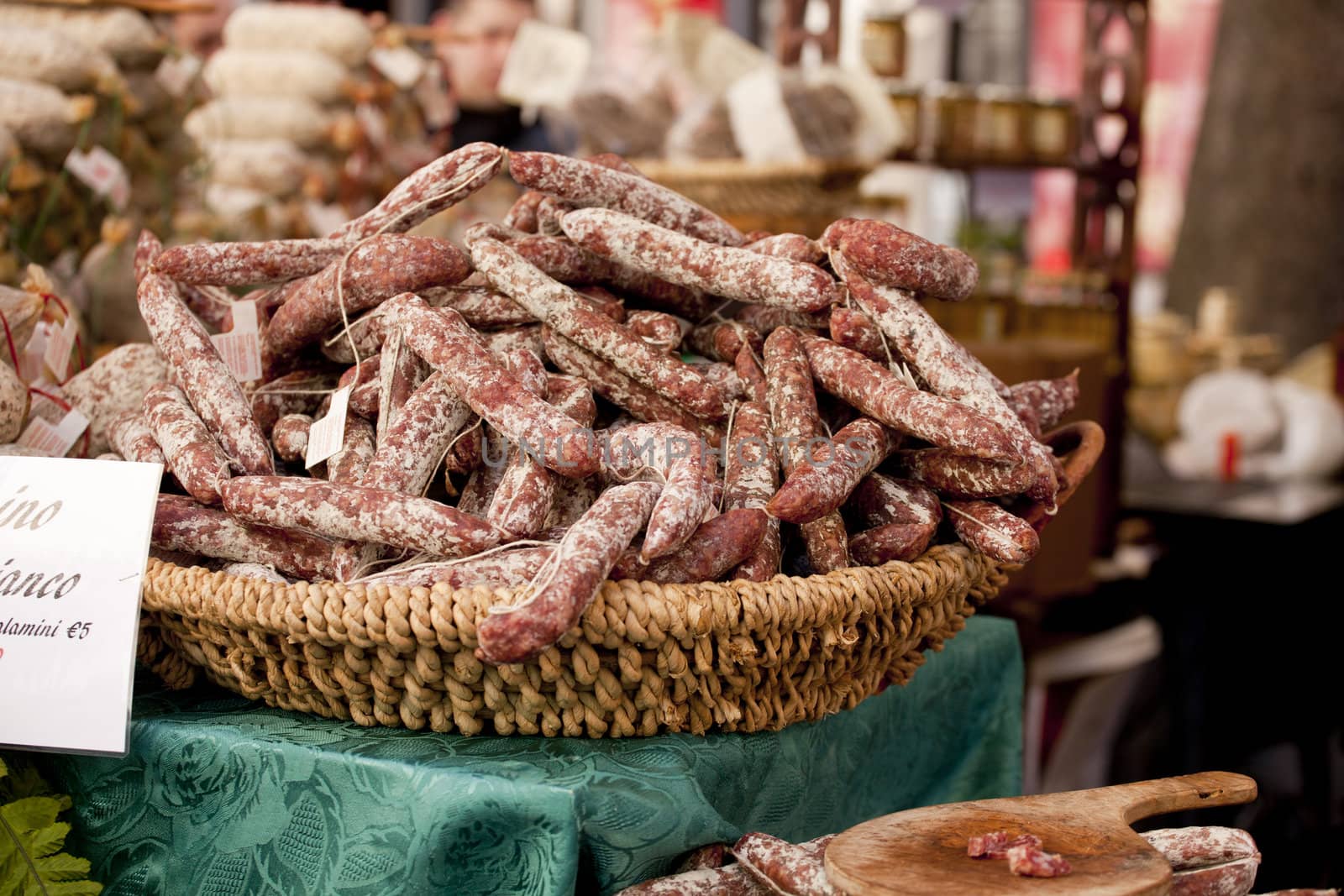 Delicious salame on wicker basket