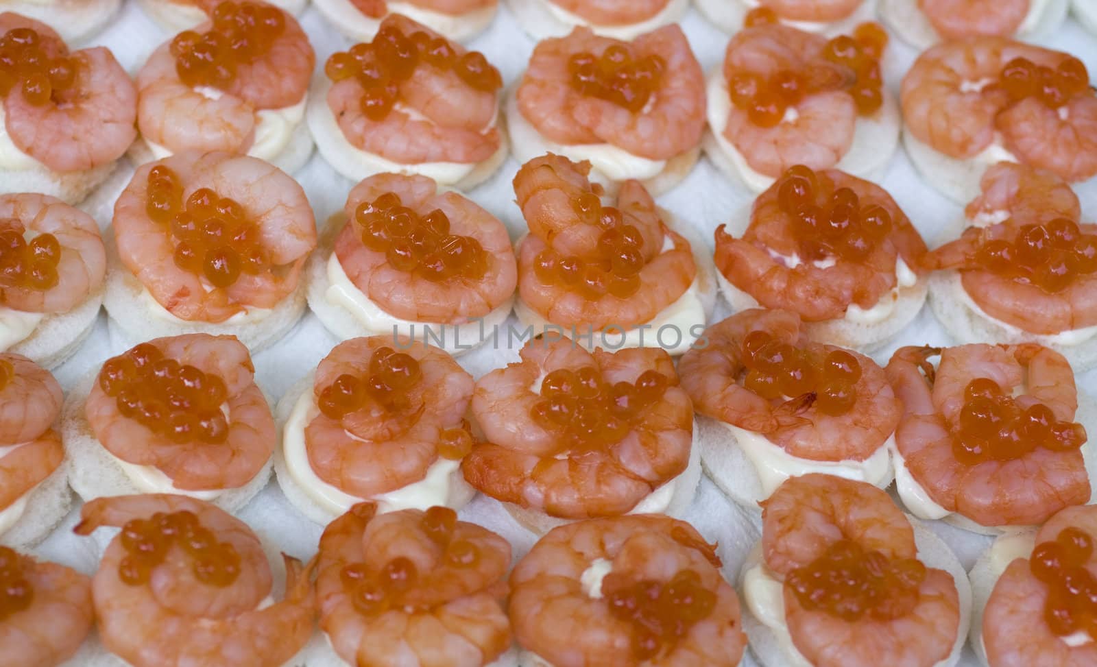 Delicious shrimp canapes on iron tray