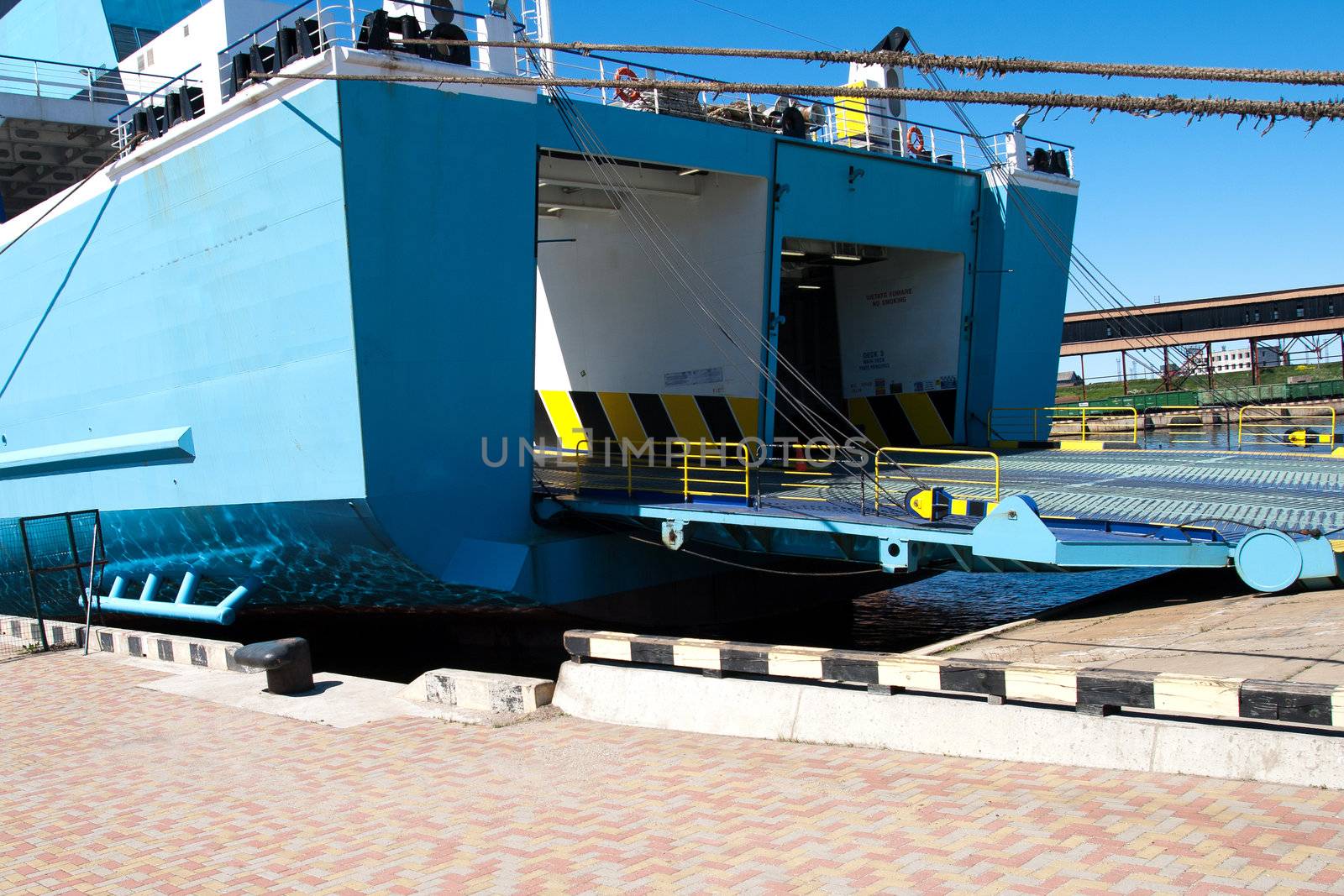 A large ferry with door open to take automobile traffic