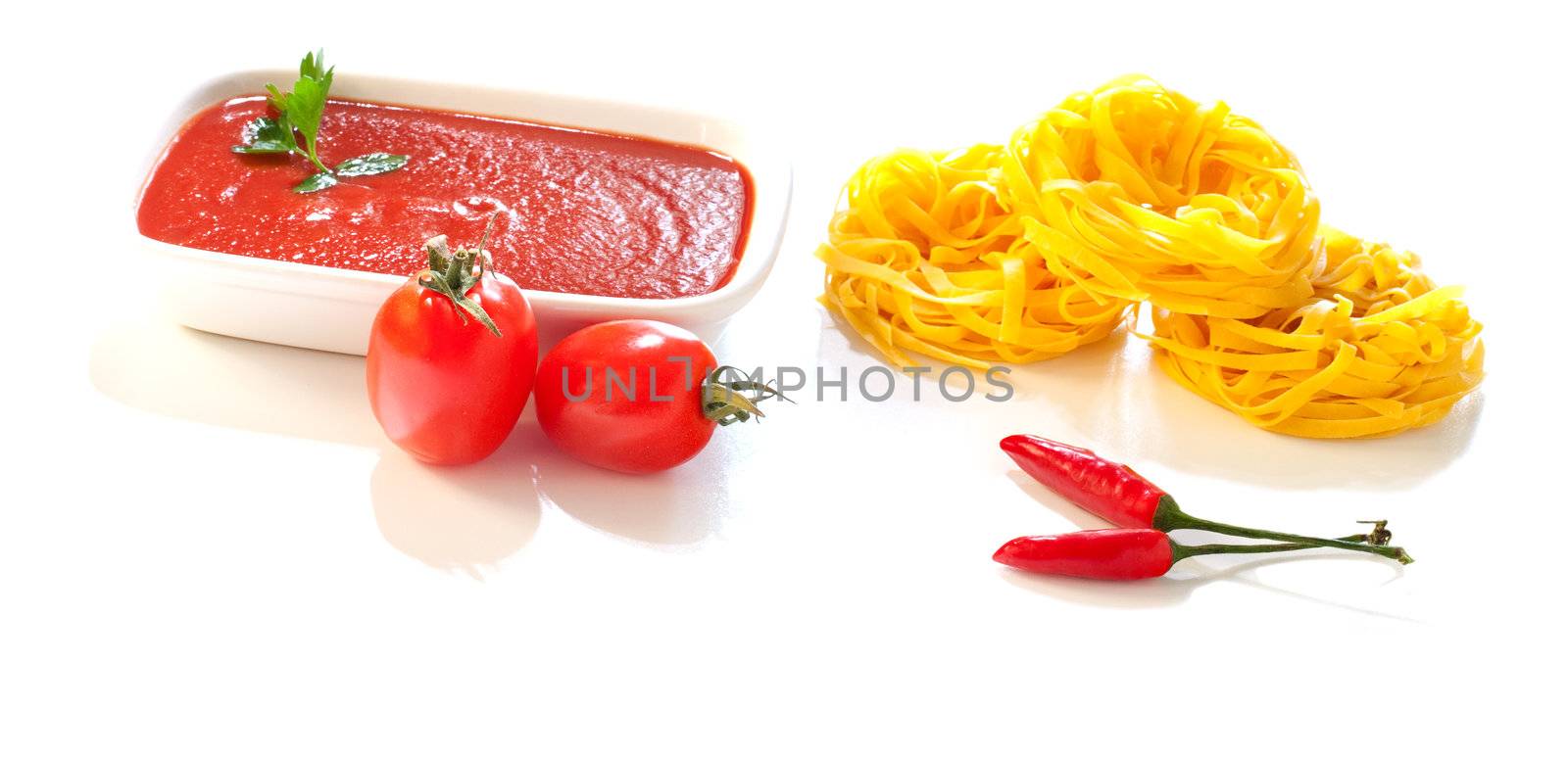 Tomatoes, tagliatelle, chili peppers and tomatoes sauce, Ingredients for italian pasta on white background