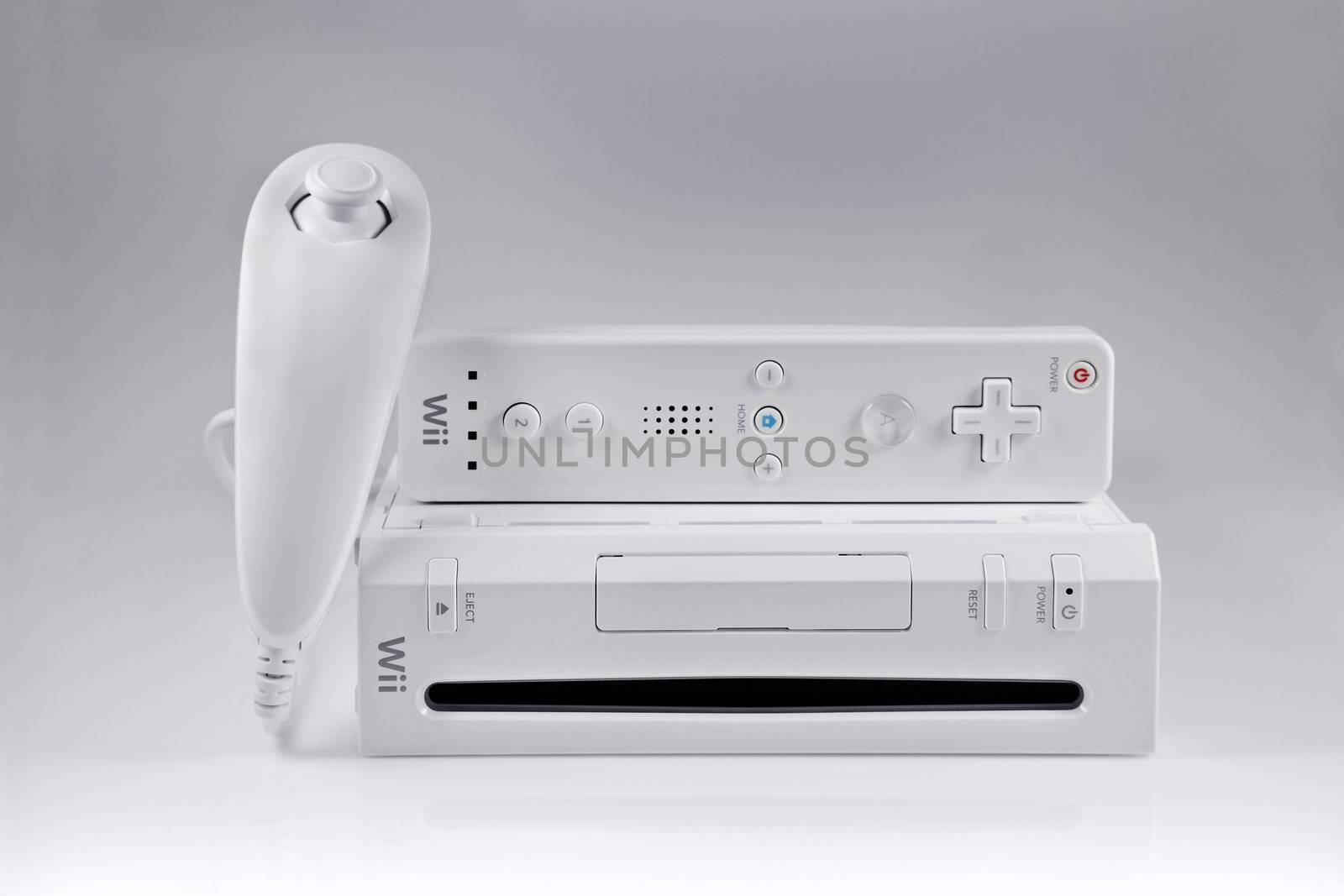 A studio shot of the Nintendo Wii video game system with the nunchuk and controller set.