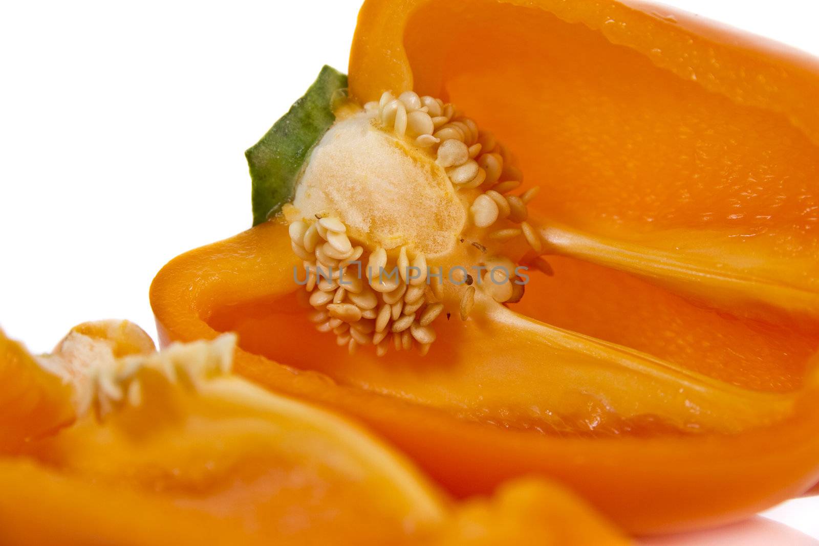 Ripped orange pepper isolated over white