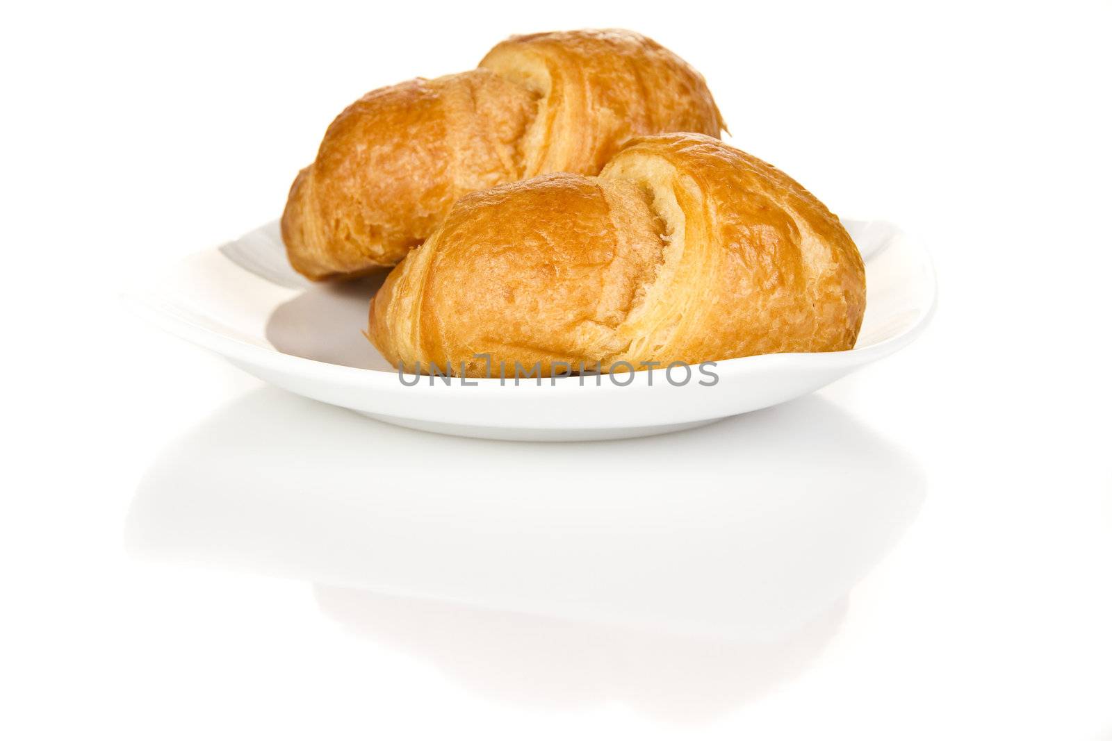 French croissants over white background